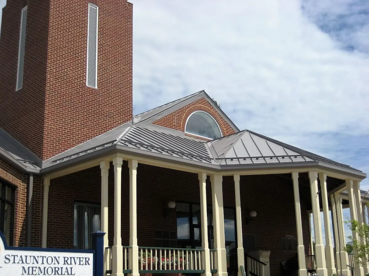 Skilled roofing craftsmen working on a residential roof in Breaux Bridge